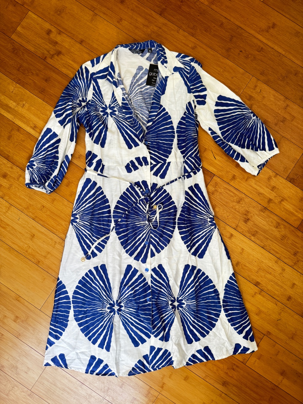 Lightweight blue white dress with buttons and a string tie, puff quarter sleeves